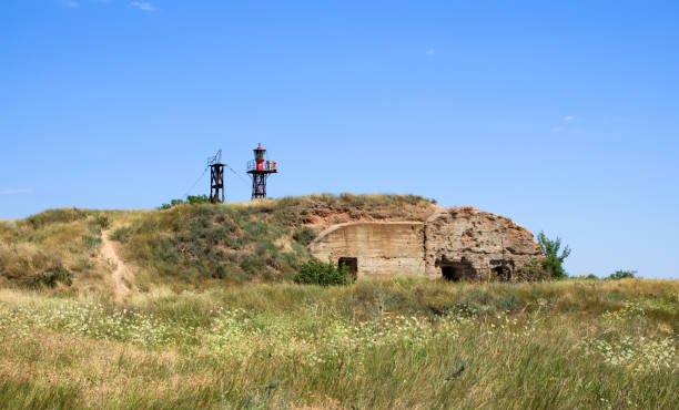 lighthouse on the island on the old wartime bunker, yellow grass