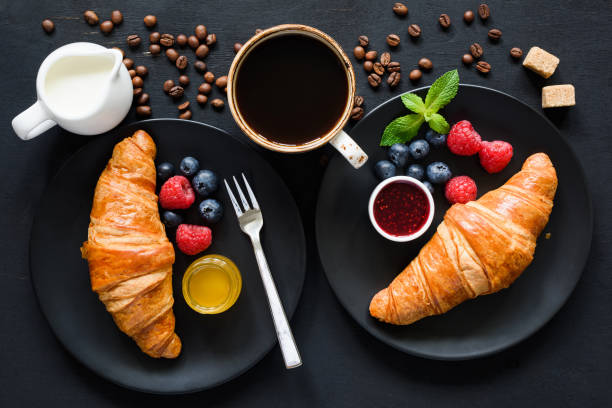 istock Breakfast with croissants, coffee and berries 995925966