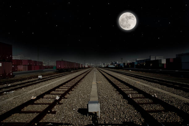 istock Full moon over the containers on freight train in yard 995928770