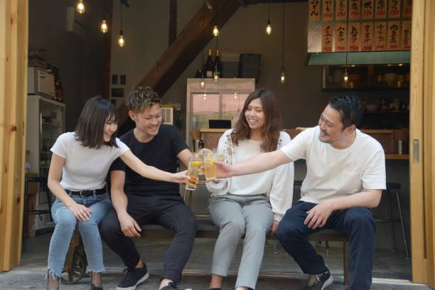 istock Young people enjoying drinking together 995932634
