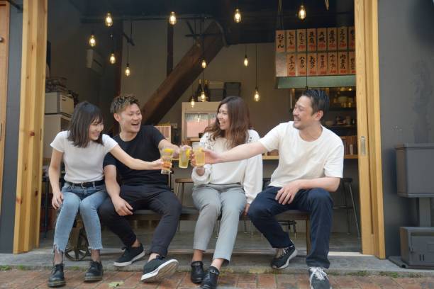 Young people enjoying drinking together