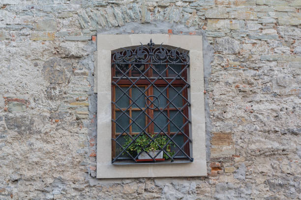 istock Old window in retro style on a brick wall. Architecture 995944934