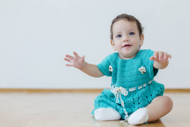 istock Baby girl on floor 995949148