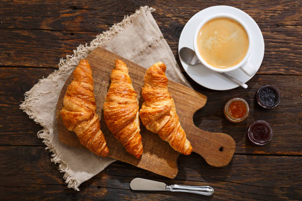 istock breakfast with fresh croissants and cup of coffee 995953154