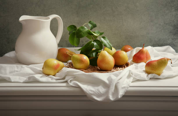 istock still life with fresh pears on wooden table 995953376