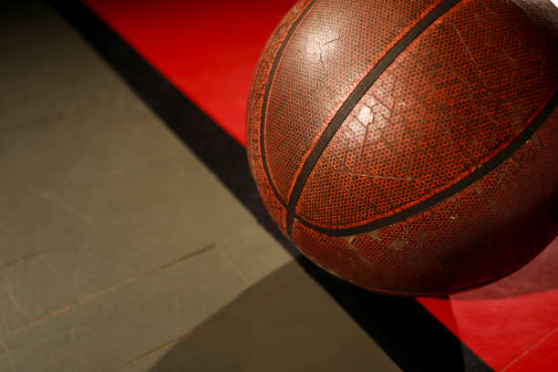 istock Basketball ball on court floor 995962320