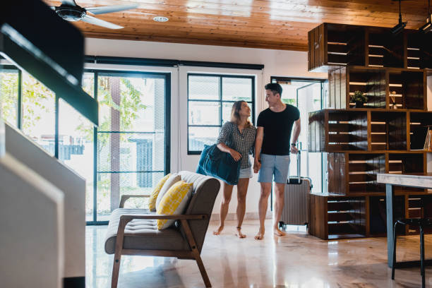 istock Chinese couple walking into their vacation house 995962782