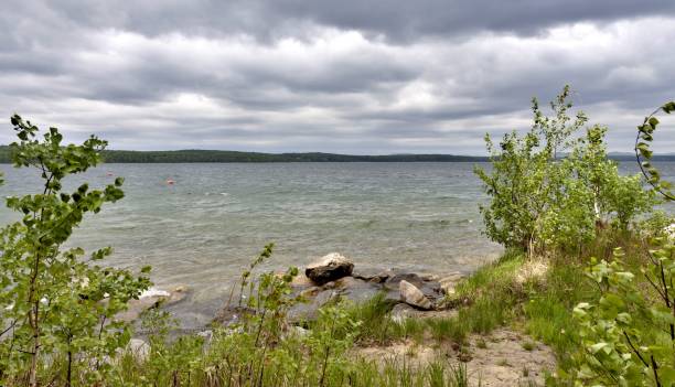 istock dark gray sky over the restless lake 995967802