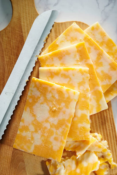 Cutting colby jack cheese Cutting colby jack cheese colby cheddar stock pictures, royalty-free photos & images