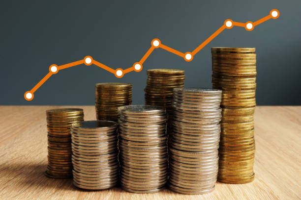 istock Wealth growth. Coins increase and financial chart. Business success. 995969344