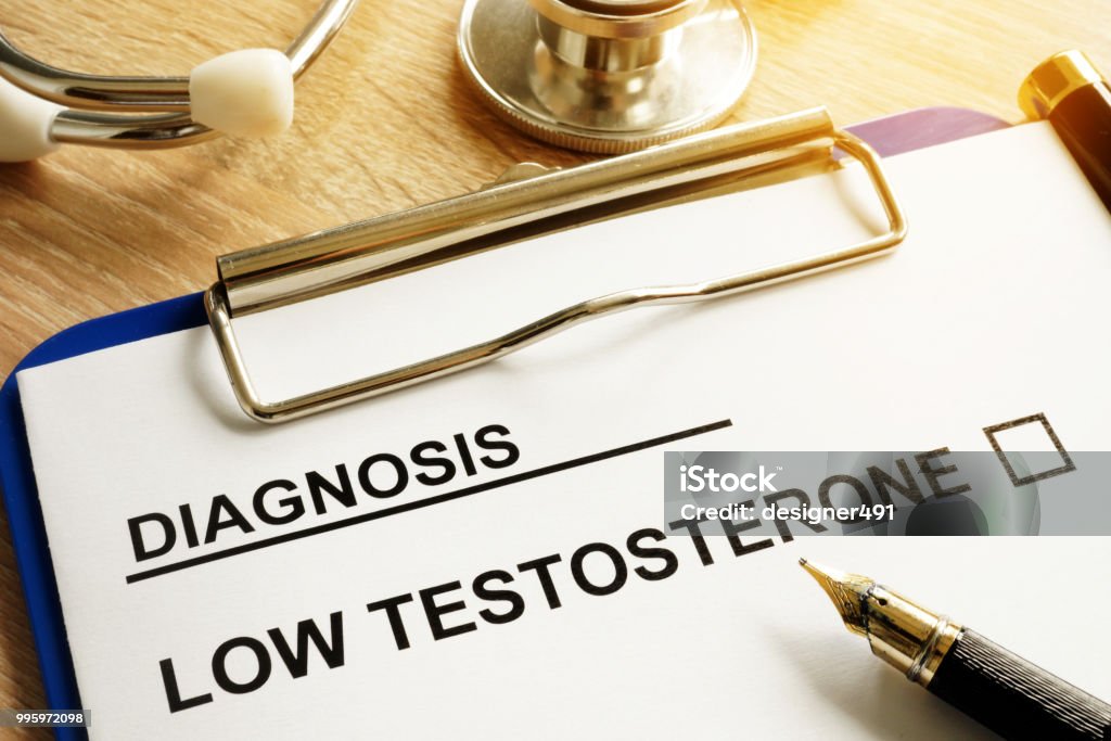 Diagnosis Low testosterone and pen on a desk. Testosterone Stock Photo