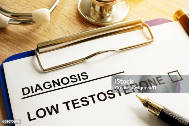 Diagnosis Low Testosterone And Pen On A Desk Stock Photo - Download Image Now - Testosterone, Low, Healthcare And Medicine