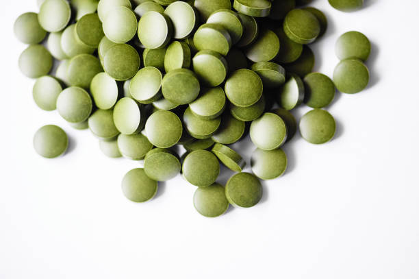 클로렐라 정제 - spirulina bacterium green vitamin pill medicine 뉴스 사진 이미지
