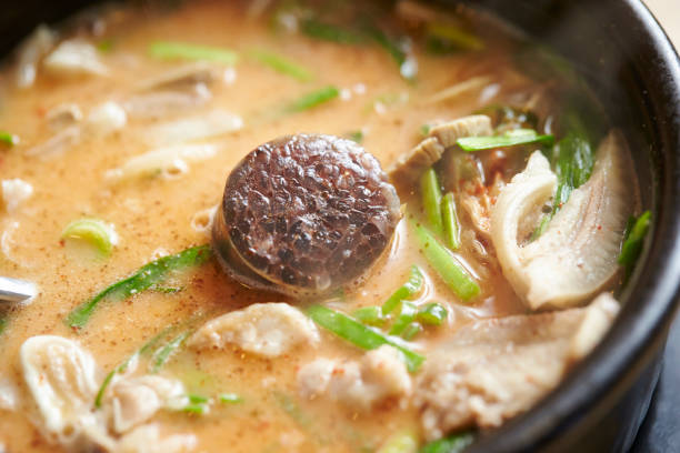Asian family enjoy tong yam seafood steamboat in Chinese New Year.