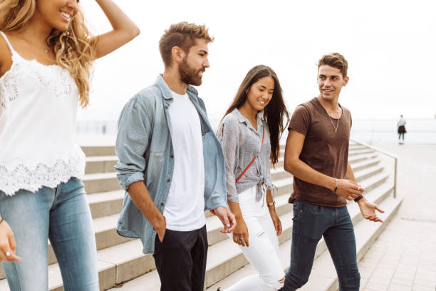 istock friends walking together in barceloneta 995981398