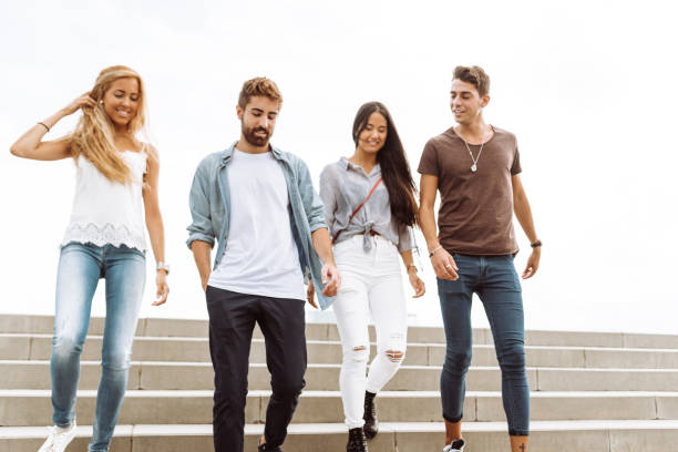 istock friends walking together in barceloneta 995981630