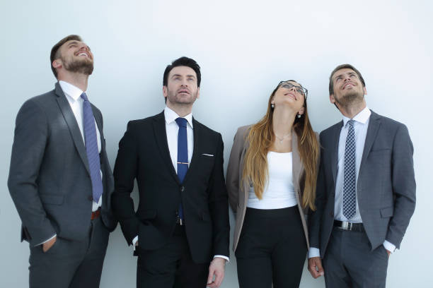 istock group of business people looking up at a copy space 995984020
