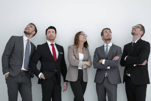 istock Happy positive business group looking up with dreaming expression 995986816