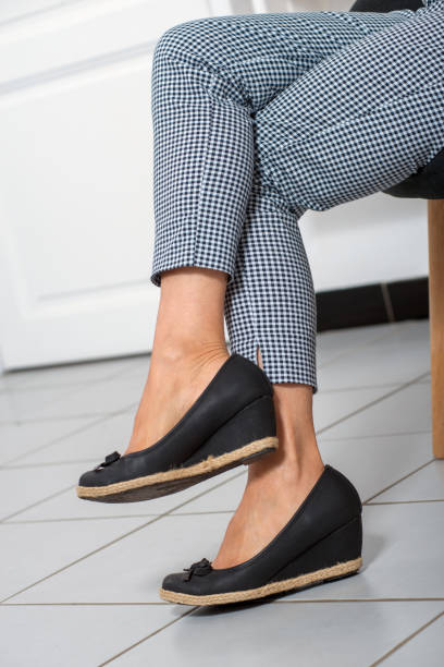 istock close-up of woman's legs with trousers 995996810