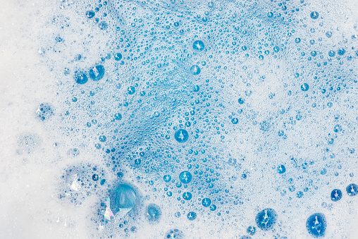 espuma de jabón con fondo macro de burbujas photo