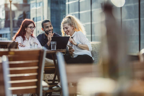 istock Business People Discussing at a Sidewalk Caffe 996007782