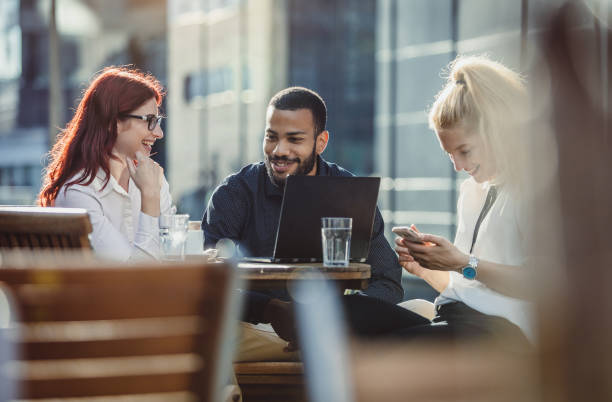 istock Business People Discussing at a Sidewalk Caffe 996015912