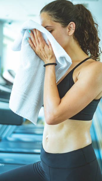 istock Sweaty woman wiping off 996016540