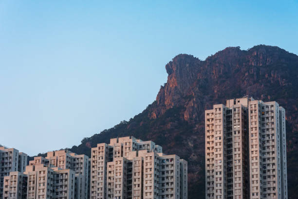 lion rock and building in Hong Kong city stock photo