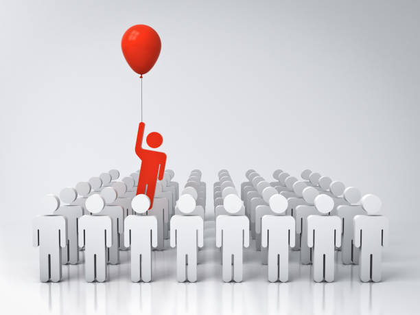 istock Stand out from the crowd and different creative idea concept One man flying away from other people with red balloon on white grey background with reflections 3D rendering 996021702