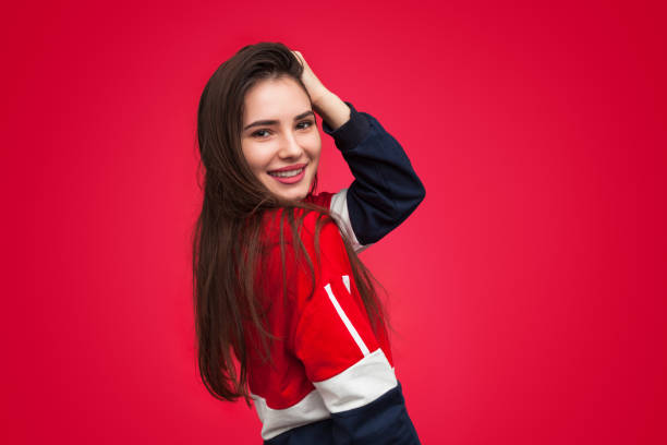 istock Stylish smiling woman touching hair 996028128