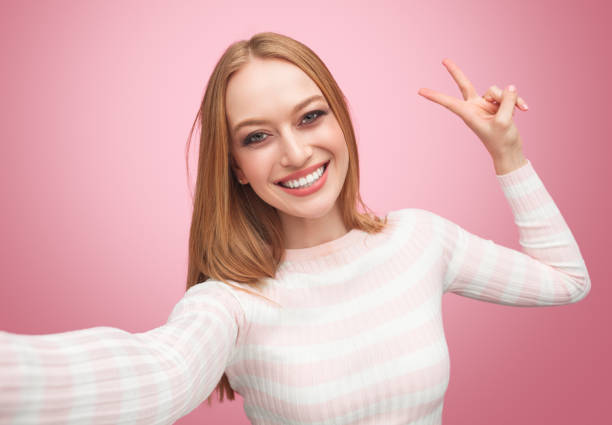 istock Woman showing peace gesture 996030568