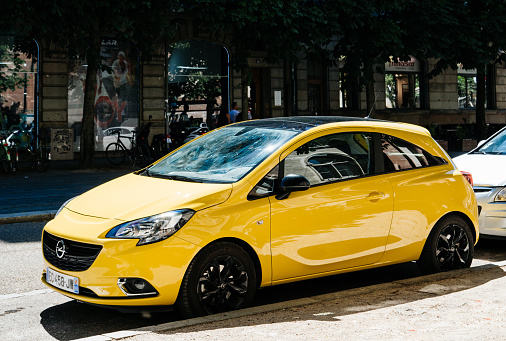 Strasbourg: New yellow Opel Corsa parked on the street in France