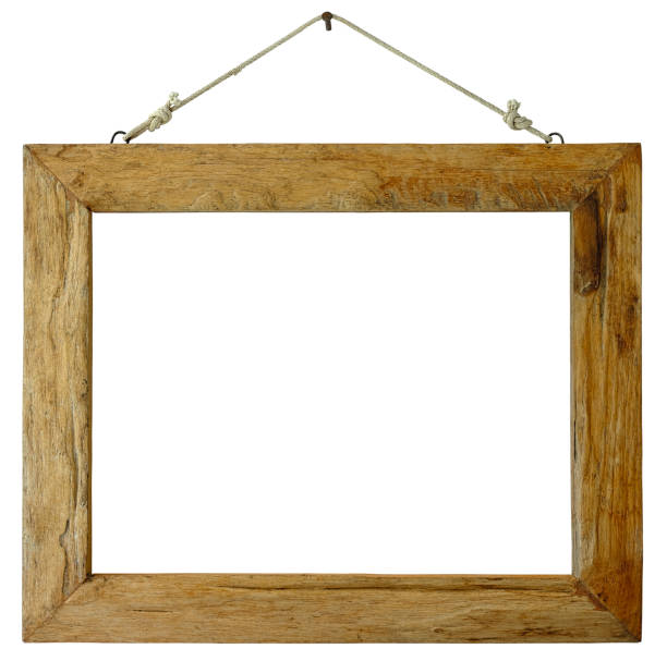istock An old weathered wooden picture frame hangs from a rusty nail, isolated on white, clipping path included. 996054480