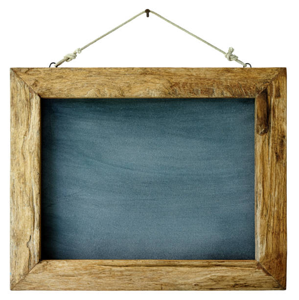 istock An old weathered wood framed blackboard hangs from a rusty nail, isolated on white, clipping path included. 996054492