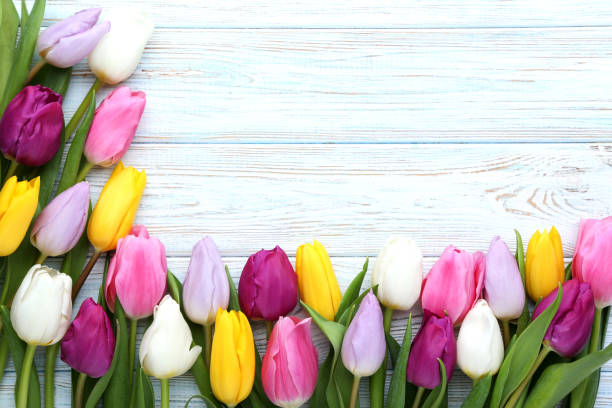 istock Bouquet of tulips on wooden table 996061222
