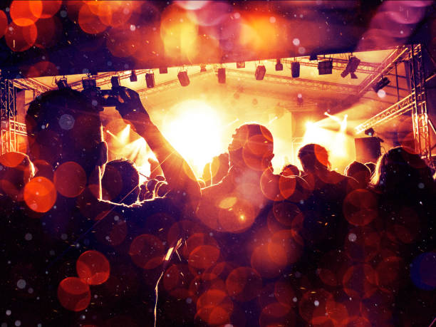istock Concert crowd in a colourful arena 996062334