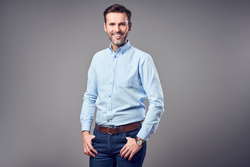 Portrait of handsome man in shirt smiling isolated