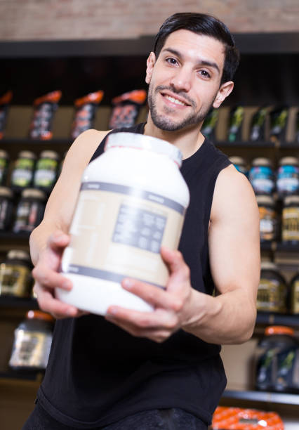 istock guy buyer showing  sport nutrition 996073614