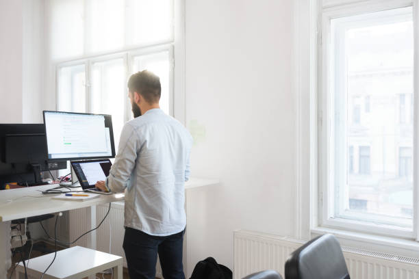istock Male developer working on his laptop at the office 996083804