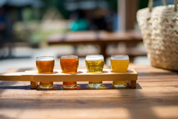 Photo of Beer flight of craft beers at outdoor beer tasting event in Canada