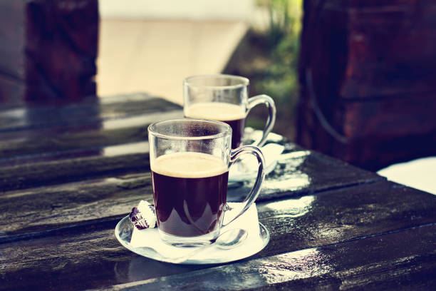 istock two espresso cups on a dark wooden table. Morning coffee. 996084276
