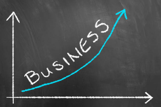 istock Business growing chart with arrow on blackboard or chalkboard 996084542