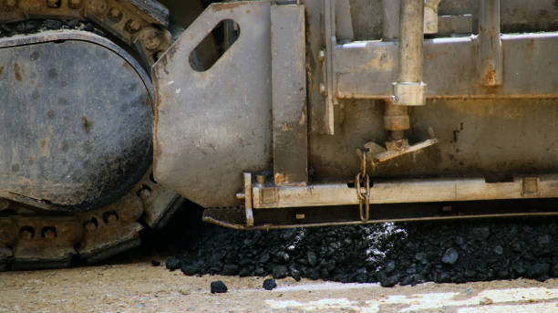 istock Road works, newly laid asphalt during road construction. 996088622