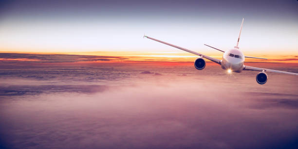 istock Commercial airplane flying above clouds 996092596