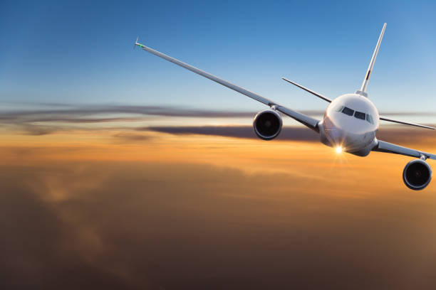 istock Commercial airplane flying above clouds 996092626