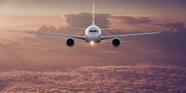 istock Commercial airplane flying above clouds 996092876
