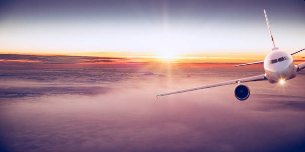 istock Commercial airplane flying above clouds 996092974