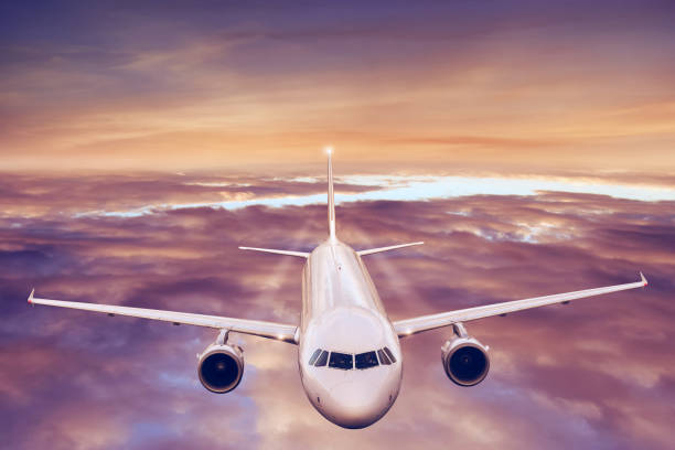 istock Commercial airplane flying above clouds 996092996