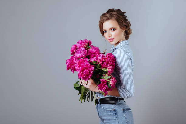 istock Fashion model with flowers. 996097120