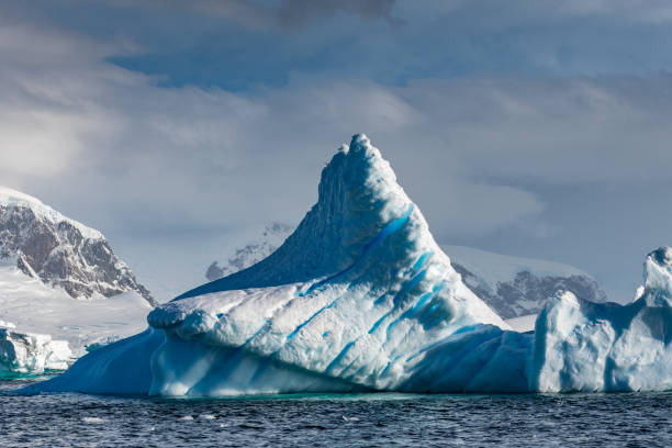 istock Weather eroded iceberg in Wilhemina Bay Antarctica 996105036
